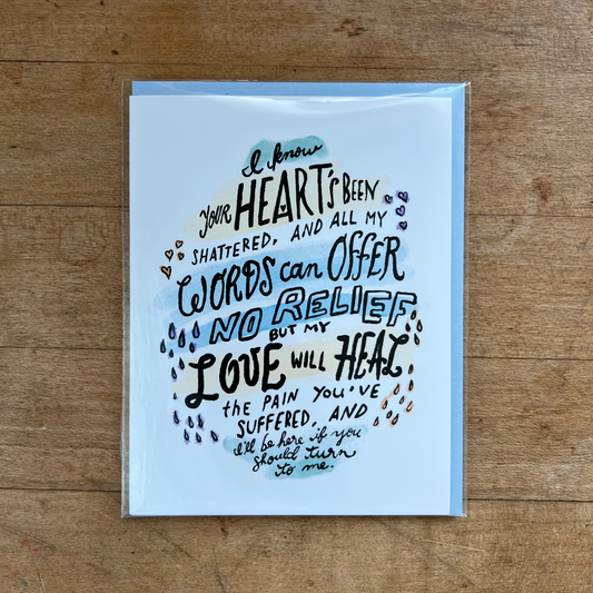 Greeting card with poetic text on a wooden surface